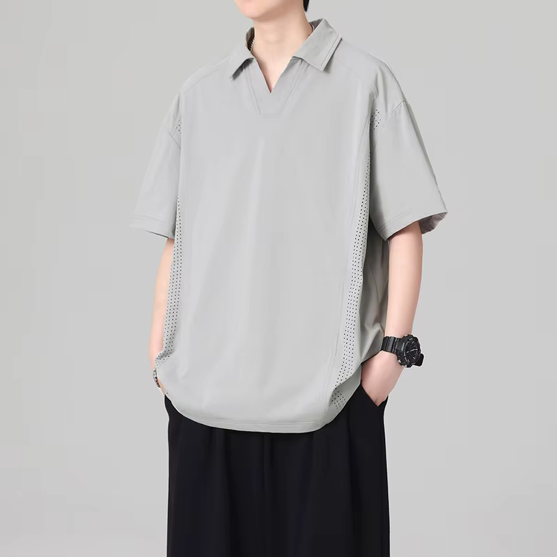 Polo pour homme à col cranté avec empiècements en maille, manches courtes, coupe ample, couleur unie