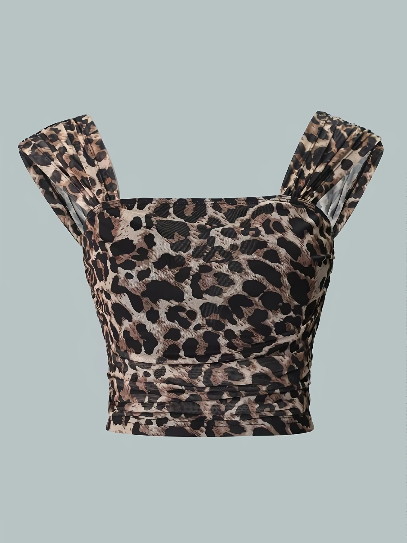 Dame avec haut sexy et élégant dos nu, extensible, à volants imprimé léopard