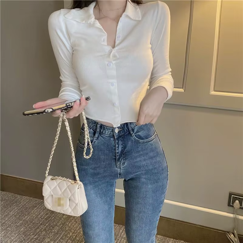 Polo uni pour femme avec bouton bleu