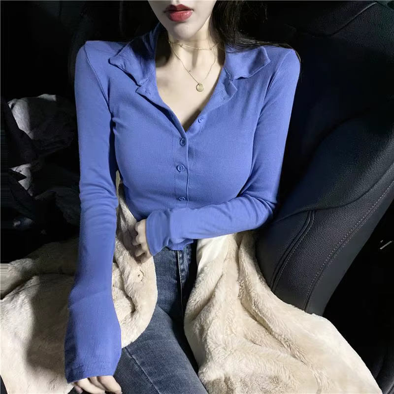 Polo uni pour femme avec bouton bleu