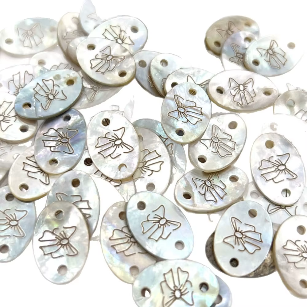 Bouton d'étiquette en coquillage exquis avec motif d'arc pour bricolage de T-shirts