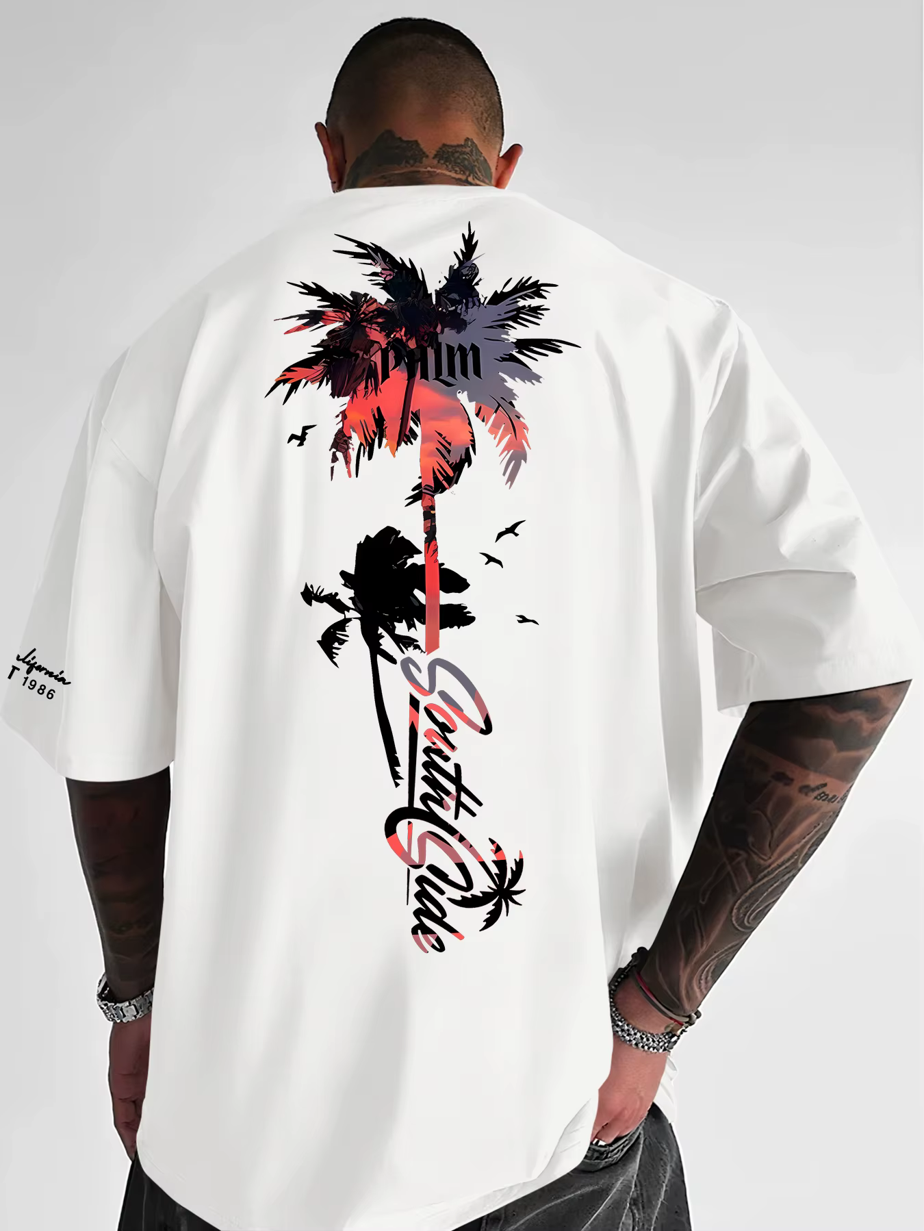 Nouveau T-shirt graphique palmier coucher de soleil tropical 2026