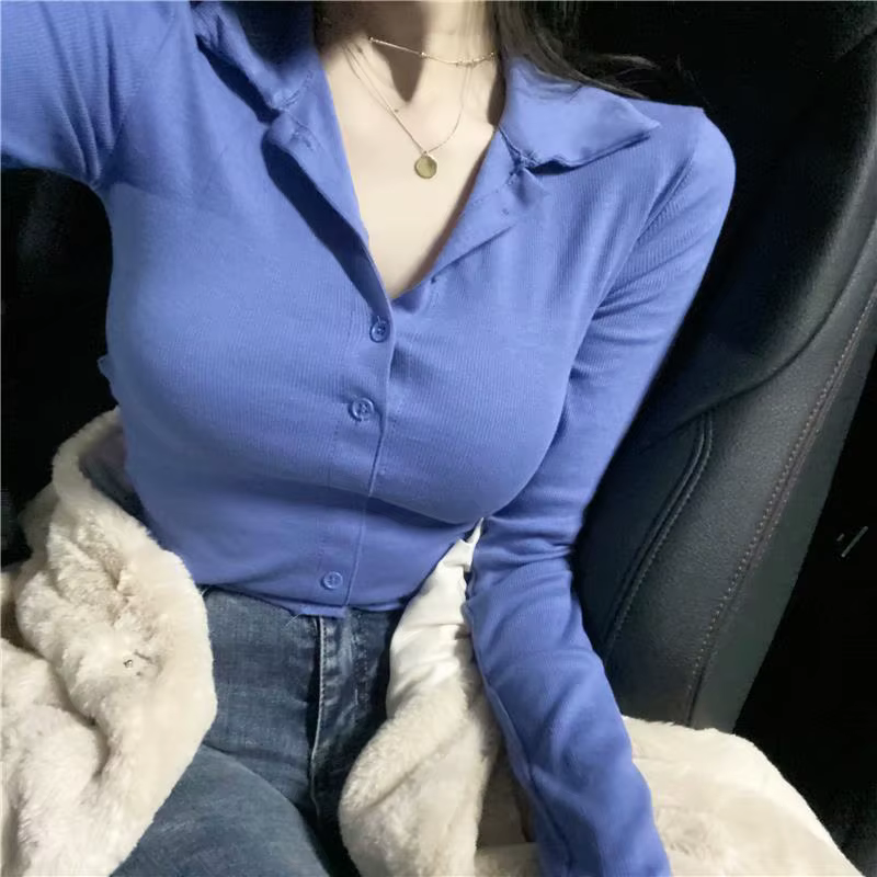 Polo uni pour femme avec bouton bleu